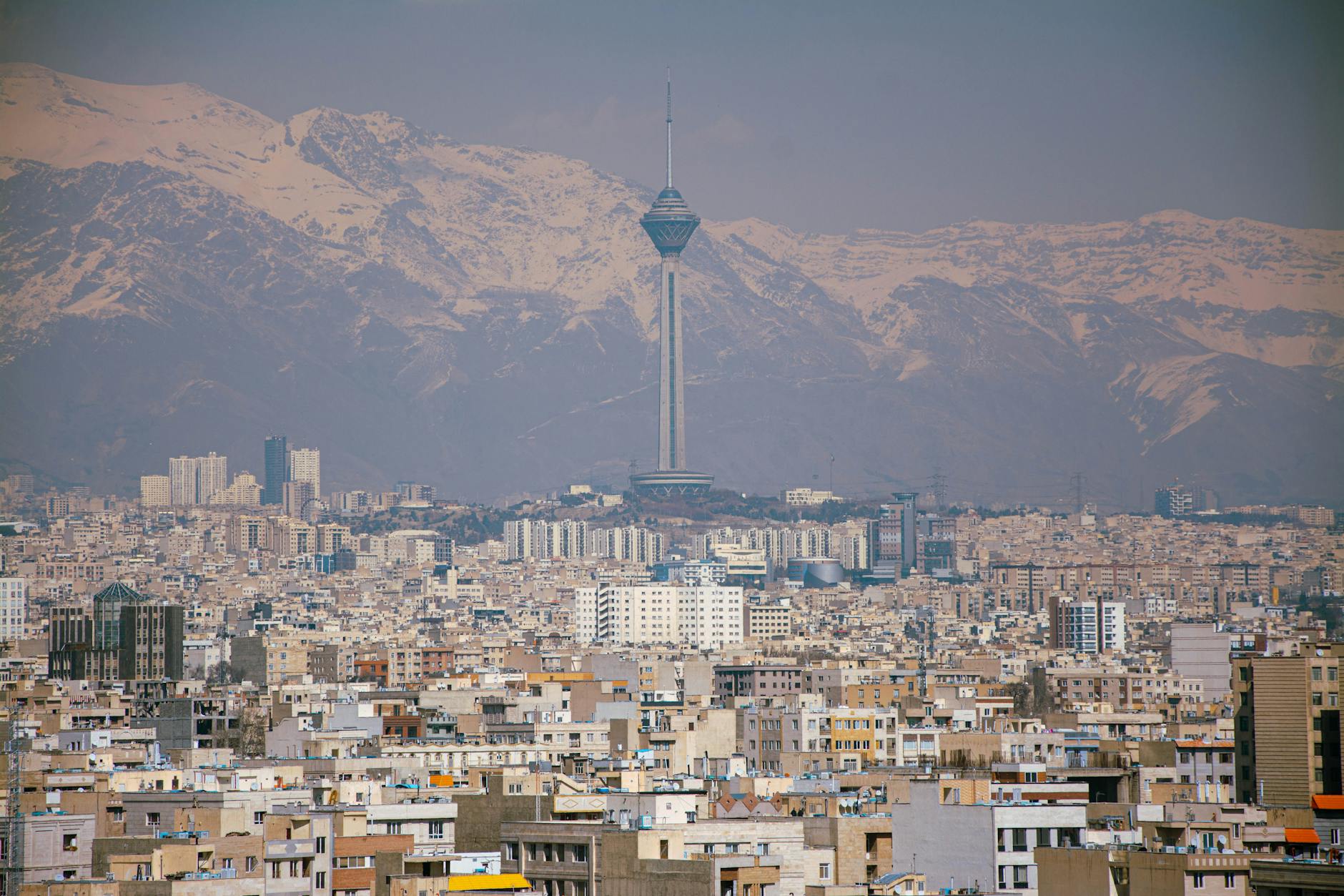 milad tower and tehran cityscape with alborz mountains